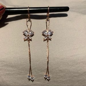 Rose gold tone dangle earrings